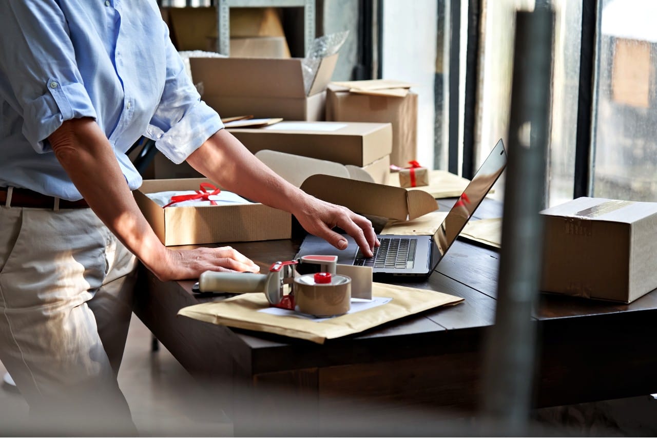 Worker packing ecommerce orders