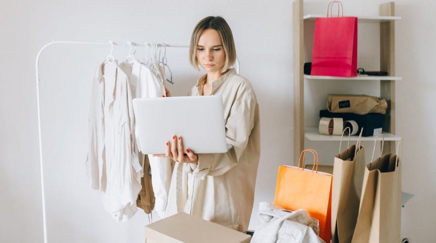 Woman with shopping bags and laptop