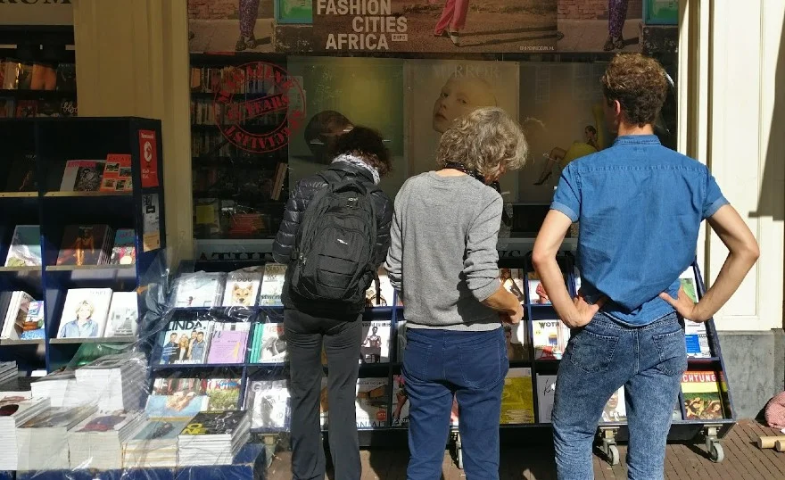 Customers by a magazine stand in Amsterdam